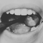 A dentist examining a patients teeth.